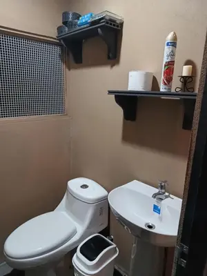 a small bathroom with a toilet and a sink at Casa Mangos in Orotina