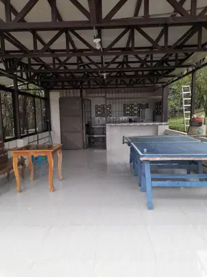 a ping pong room with two ping pong tables at Casa Lapas. in Aguas Zarcas