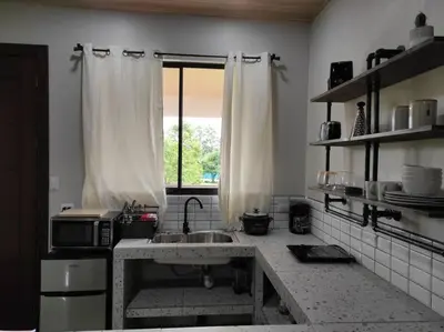 a kitchen with a sink and a window at Mandy Loft -40MB wifi -8 miles from La Fortuna in San Ramón