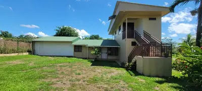 a house with a staircase and a yard at Mandy Loft -40MB wifi -8 miles from La Fortuna in San Ramón