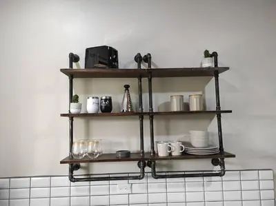 a kitchen shelf with dishes and glasses on it at Mandy Loft -40MB wifi -8 miles from La Fortuna in San Ramón