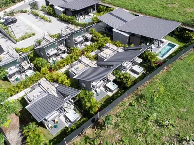 an aerial view of a house with solar panels on it at BAUMA in Fortuna