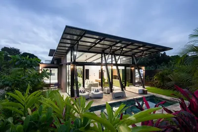 a modern house with a pool in a garden at BAUMA in Fortuna
