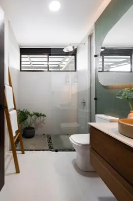a bathroom with a toilet and a shower and a sink at BAUMA in Fortuna