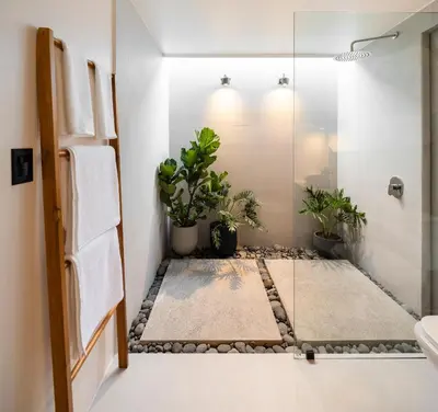 a bathroom with potted plants and a shower at BAUMA in Fortuna