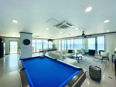 a large living room with a pool table at Ocean View, Luxury Penthouse at Diamonte del Sol 702N in Jacó