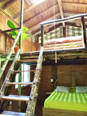 a couple of bunk beds in a room at Yogachal Vista Mar Bamboo House in the Jungle in Ojochal