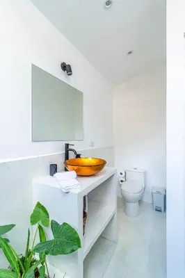 a bathroom with a sink and a toilet at Casa Bonimus in Santa Teresa Beach