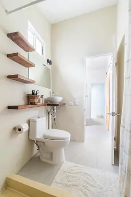 a bathroom with a toilet and a sink at Casa Bonimus in Santa Teresa Beach