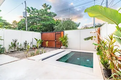 a swimming pool in the backyard of a house at Casa Bonimus in Santa Teresa Beach