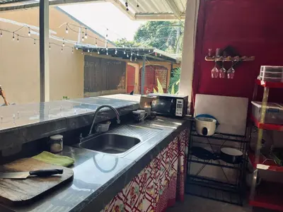 a kitchen with a sink and a counter top at Gamboa Lodging 1 in Liberia