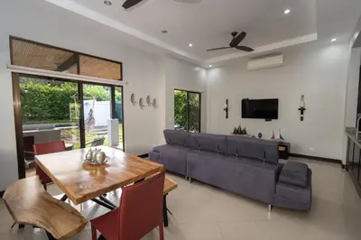 a living room with a couch and a table at Casa Aqua in Tamarindo
