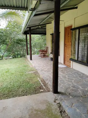 an outside view of a house with a patio at Natural paradise in Turrialba