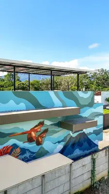 a mural on the side of a building at Rooftop and stunning Arenal Volcano views 3 minutes from La Fortuna in Fortuna