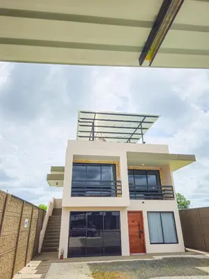 a house with a view of it at Rooftop and stunning Arenal Volcano views 3 minutes from La Fortuna in Fortuna