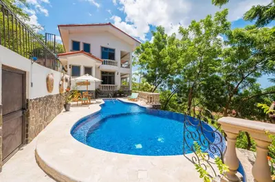 an image of a villa with a swimming pool at Casa Del Mar- 3 Br Ocean View House In Flamingo in Playa Flamingo