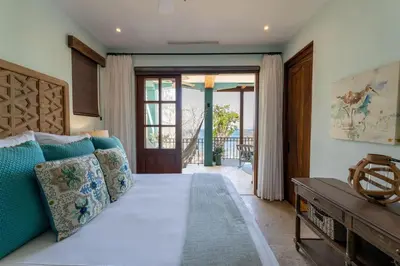 a living room with a couch and a table at Casa De Los Sueños - 3 Bedroom Home At Las Catalinas in Playa Danta