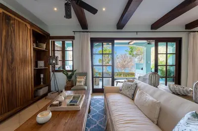 a living room with a couch and a table at Casa De Los Sueños - 3 Bedroom Home At Las Catalinas in Playa Danta