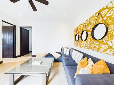 a living room with a couch and a table at Casa Virginia #5 Private Pool -Ocean View At Las Catalinas in Playa Danta