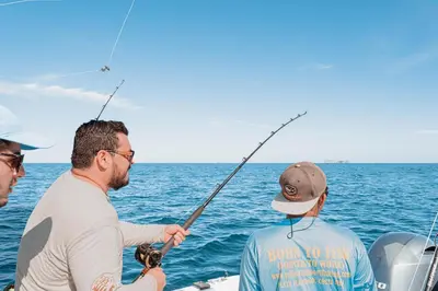 three men fishing on a boat in the ocean at 360 Splendor 407 -Ocean View -Breakfast Included! in Playa Flamingo