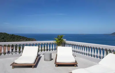 two chairs on a balcony overlooking the ocean at 360 Splendor 407 -Ocean View -Breakfast Included! in Playa Flamingo