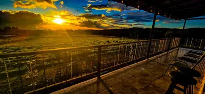 a view of the sunset from the balcony of a ship at Hotel Almore in Monteverde Costa Rica