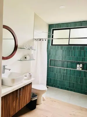 a bathroom with a sink and a toilet and a shower at Casa Bellota in Marbella