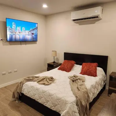 a bedroom with a bed with two pillows on it at Casa Bellota in Marbella