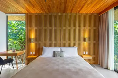a bedroom with a large bed with a wooden ceiling at Brand-new luxury Villa Element in Carmen