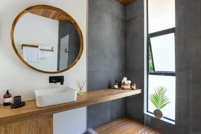 a bathroom with a sink and a mirror at Brand-new luxury Villa Element in Carmen