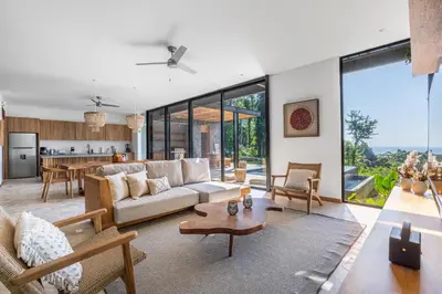 a living room with a couch and a table at Brand-new luxury Villa Element in Carmen
