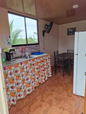 a kitchen with a counter filled with plates of food at Pocho's Place Rio Celeste in San Antonio
