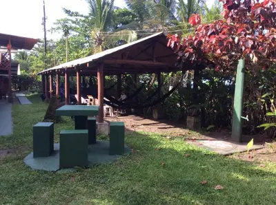 a pavilion with a picnic table in a park at Cabinas Balcon del Mar Tortuguero in Tortuguero