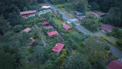 an overhead view of a village with houses and a road at Hotel Rancho Cerro Azul in Fortuna