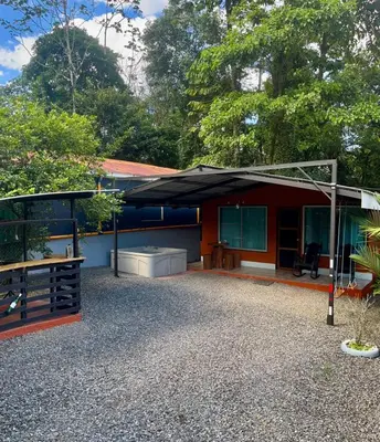 a house with a pavilion in front of it at Cabaña que Tuanis in Fortuna