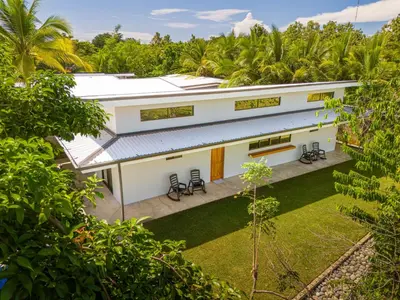 an aerial view of a house with a yard at Luxury 2 bedroom, walking distance to beach in Uvita