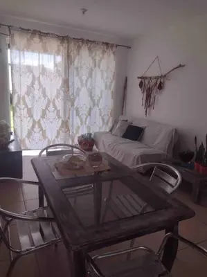 a living room with a table and chairs and a bed at Casa de playa, Bejuco Costa Rica in Bejuco