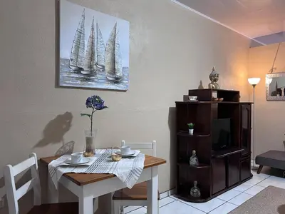 a dining room with a table with two sails on the wall at Casa Tatich AC near Guanacaste Airport in Liberia