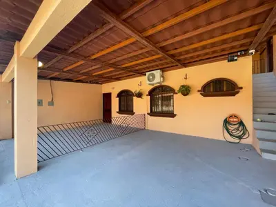 an empty garage with a wooden ceiling and a patio at Casa Tatich AC near Guanacaste Airport in Liberia