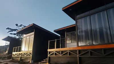 two modern houses with large windows on them at Mon Bellis in El Copey