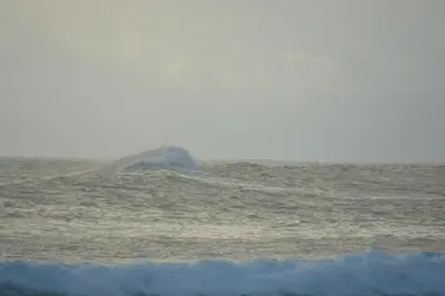 a rock in the middle of the ocean at Indigo Yoga Surf Resort in Mal País