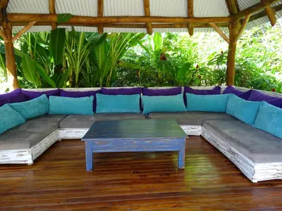 a blue couch with a coffee table in a room at Indigo Yoga Surf Resort in Mal País