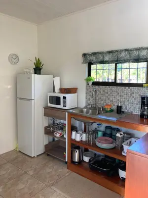 a kitchen with a white refrigerator and a sink at Rincón Sereno San Carlos in La Marina
