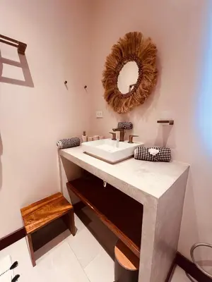 a bathroom with a sink and a mirror on the wall at Veranera in Uvita