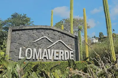 a sign for a landscape with a house at Casa Frangipani in Santa Rosa de Tamarindo in Santa Cruz