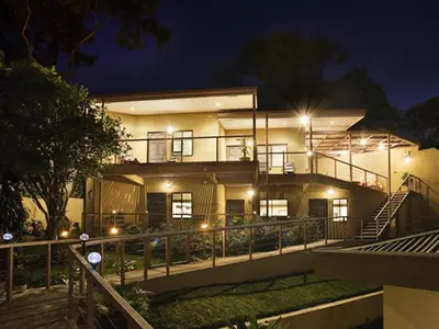 a house at night with lights on it at Out of Bounds Boutique Hotel in San José