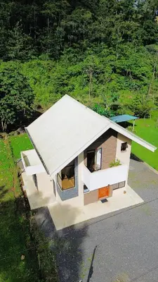 a rendering of a small house on a street at Casa Colibrí in Bijagua