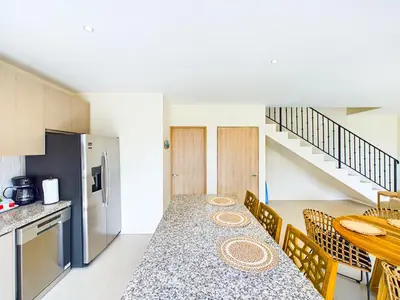 a kitchen and dining room with a table and chairs at Seaside Escape At Las Catalinas in Playa Danta