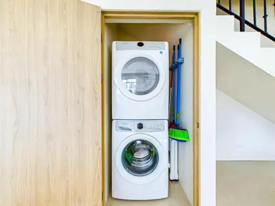 a washer and dryer in a room next to a staircase at Seaside Escape At Las Catalinas in Playa Danta
