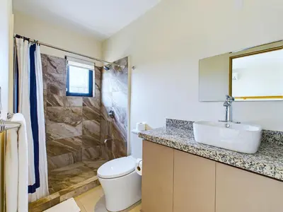 a bathroom with a sink and a toilet and a shower at Seaside Escape At Las Catalinas in Playa Danta
